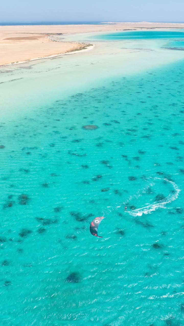 Kite coaching session alongside the safety boat